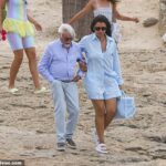 Bernie Ecclestone, 93, is helped onto a dinghy by wife Fabiana Flosi, 47, as they kick off his daughter Tamara’s 40th birthday celebrations in Ibiza