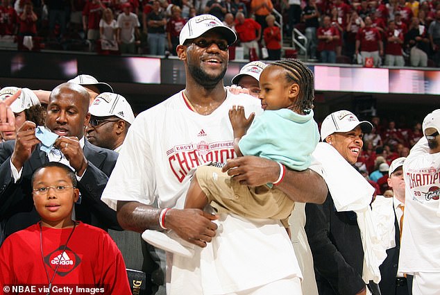 LeBron James is seen holding young Bronny after reaching his first NBA Finals in 2007