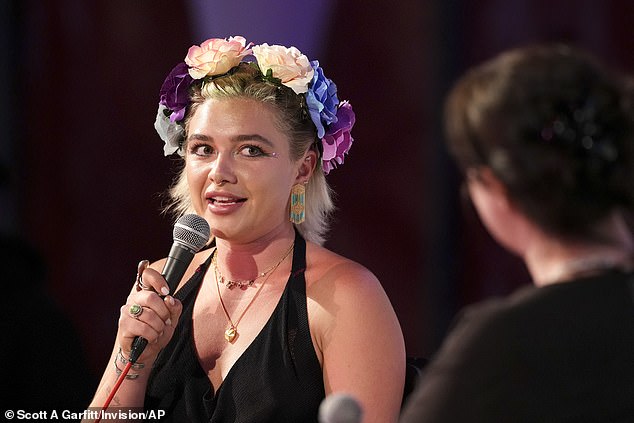 The Don't Worry Darling star teamed her look with an eye-catching floral headband during the talk