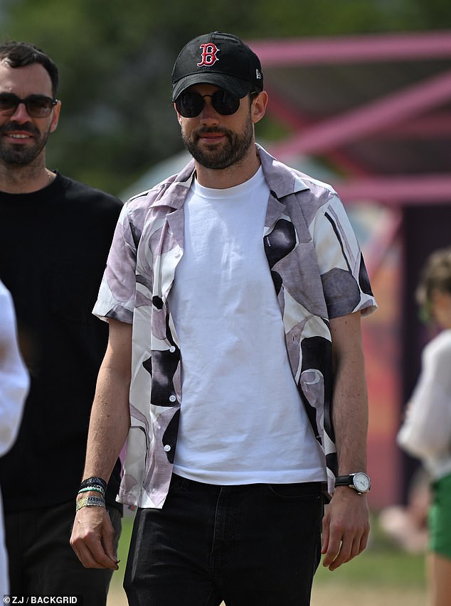 Jack Whitehall, 35, put on a casual display in a white T-shirt and bright overshirt as he was spotted strolling through the fields.