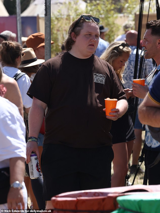 Lewis Capaldi was also spotted enjoying the festival, where he chatted with friends and enjoyed an icy cold drink.