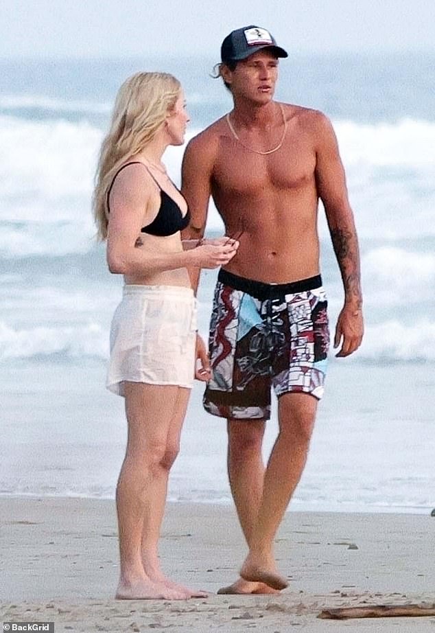 Ellie has now moved on with hunky surfer Armando Perez (pictured together in March)
