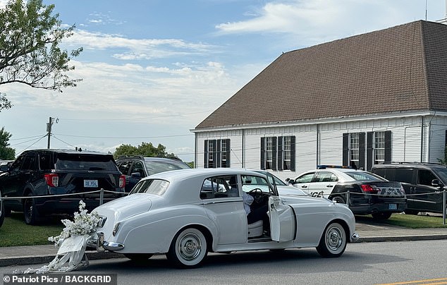 The special white wedding car was also seen