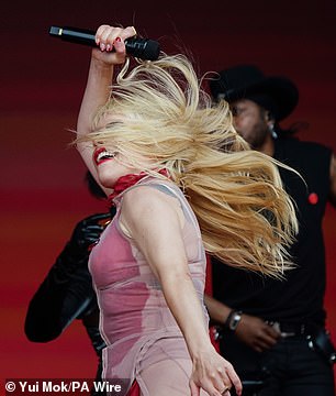 The singer danced wildly and let her long hair fly wild during her energetic set