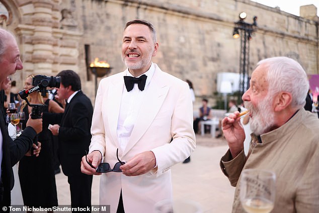 David was also spotted with fellow English star and acclaimed writer and director Mike Leigh, 81, as guests enjoyed drinks ahead of the ceremony