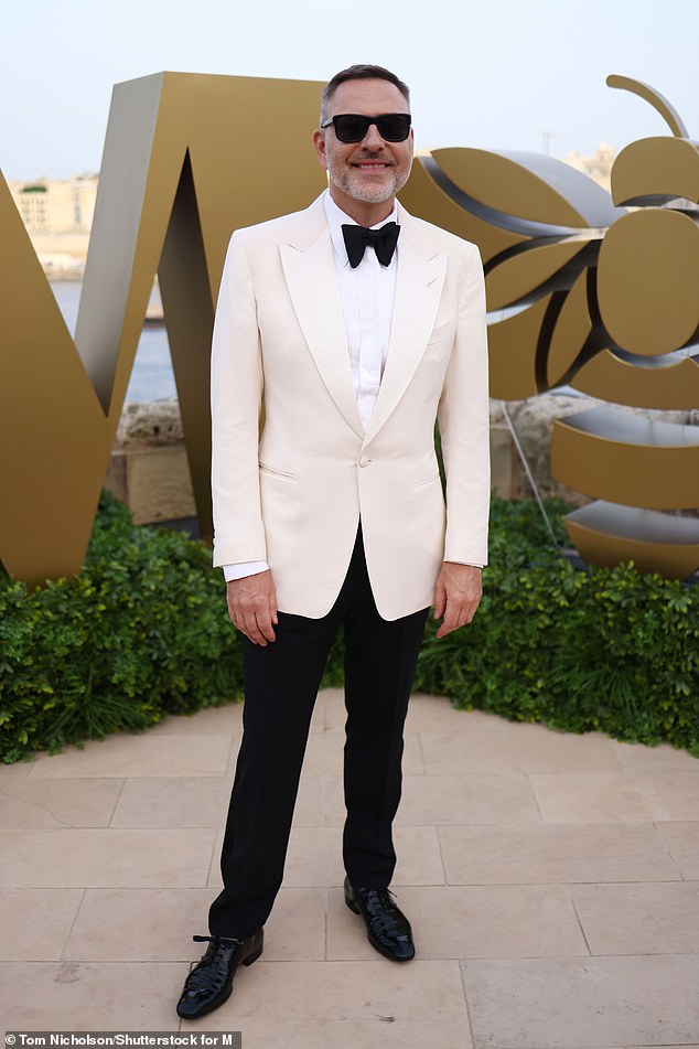 The 52-year-old comedian pulled out all the stops to look his best in a cream-coloured tuxedo jacket and large black bow tie, paired with a white shirt underneath and black trousers.