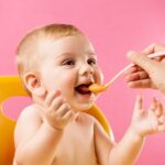Spoon feeding infants may be bad for their growth, study finds – as letting babies hand feed themselves could be better for their development