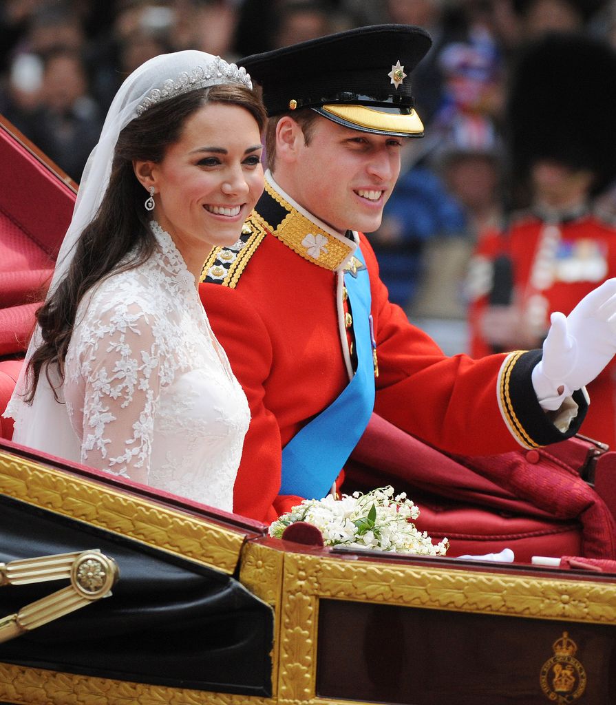 Prince William and Kate wave to the crowd after their wedding