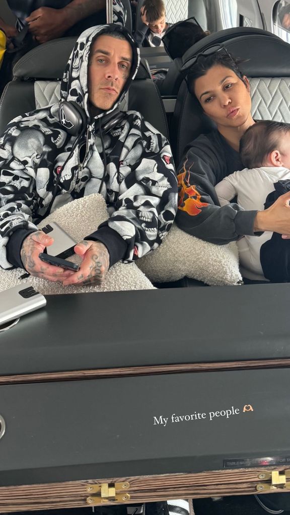 Kourtney Kardashian and her husband Travis Barker with their son Rocky