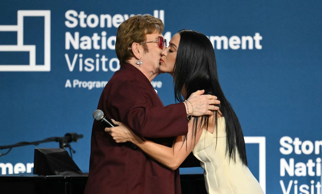 Katy Perry and Elton John kiss onstage at the grand opening of the Stonewall National Monument Visitor Center