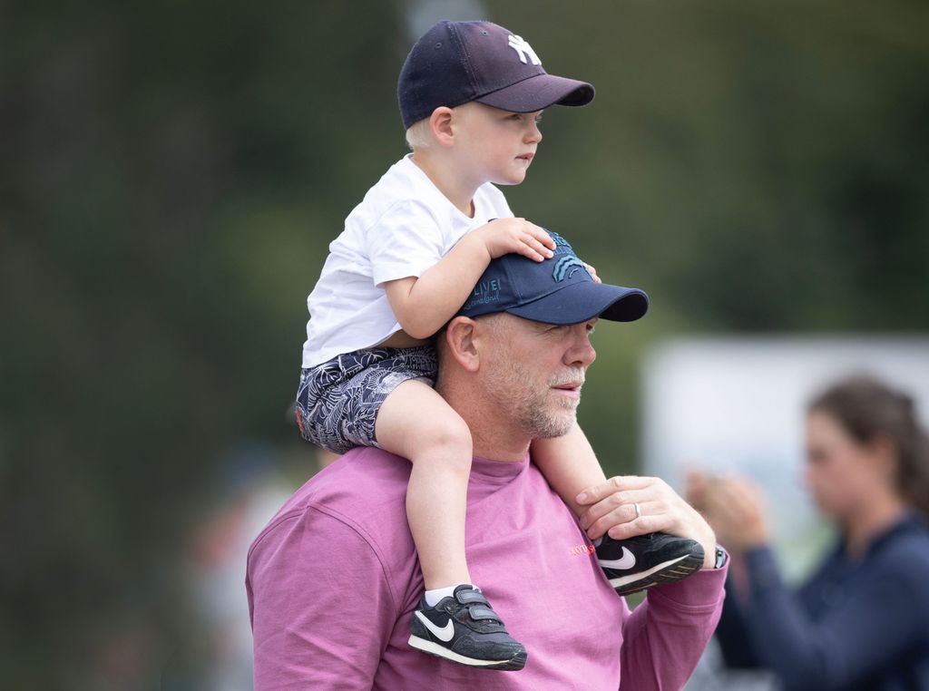 Lucas Tindall sitting on father Mike's shoulders