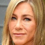 Jennifer Aniston showcases her incredible physique in tight-fitting red dress