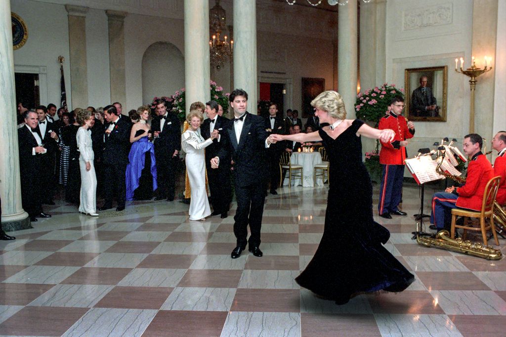 Princess Diana dances with John Travolta in the Cross Hall of the White House during an official dinner on November 9, 1985 in Washington, DC.