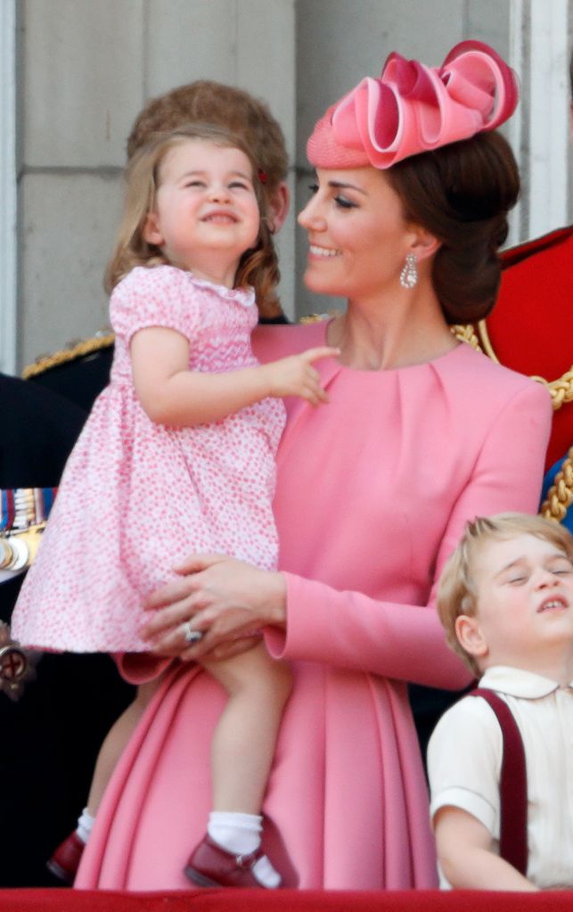 Catherine, Duchess of Cambridge and Princess Charlotte of Cambridge watch the flypast from the balcony of Buckingham Palace during the annual Trooping the Colour parade on June 17, 2017 in London, England. 