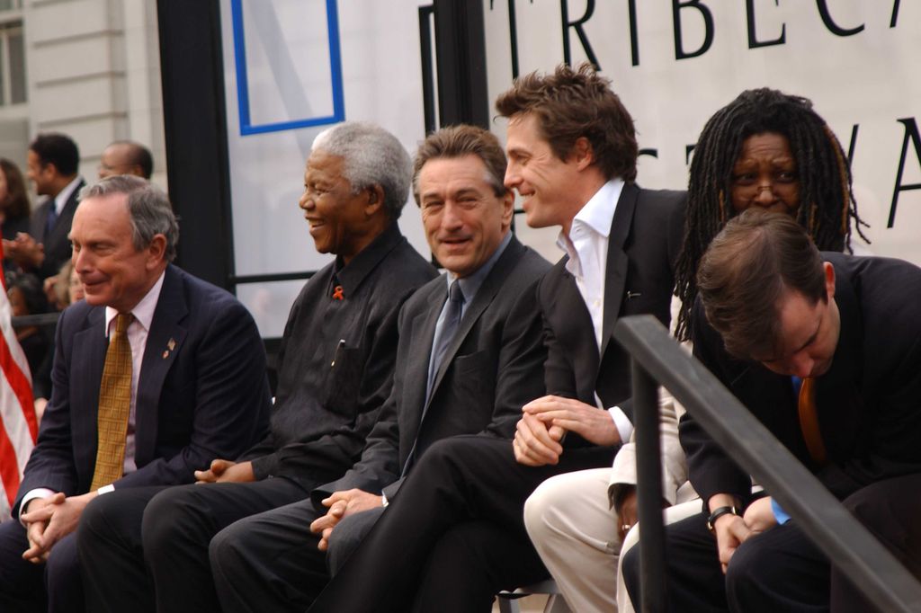 New York City Mayor Michael Bloomberg, South African activist and politician Nelson Mandela, and actors Robert De Niro, Hugh Grant and Whoopi Goldberg, view from left, during the opening ceremonies of the 2002 Tribeca Film Festival at City Hall, New York, New York, May 8, 2002.