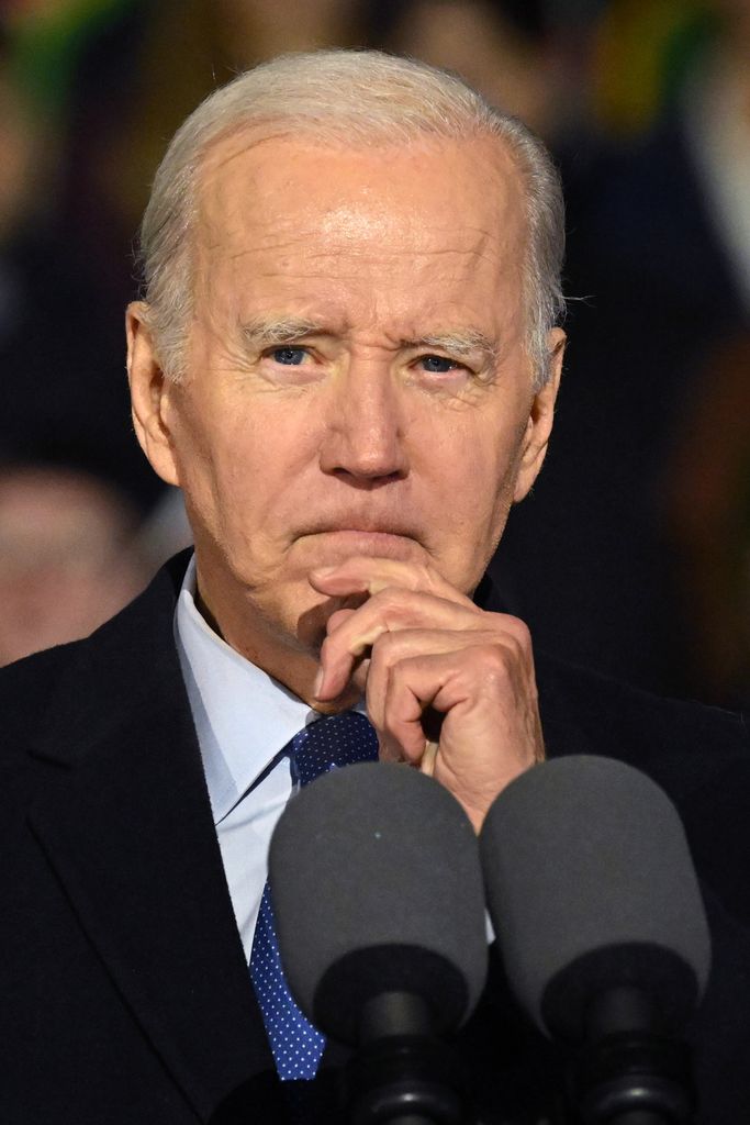 President Joe Biden with his hand on his chin