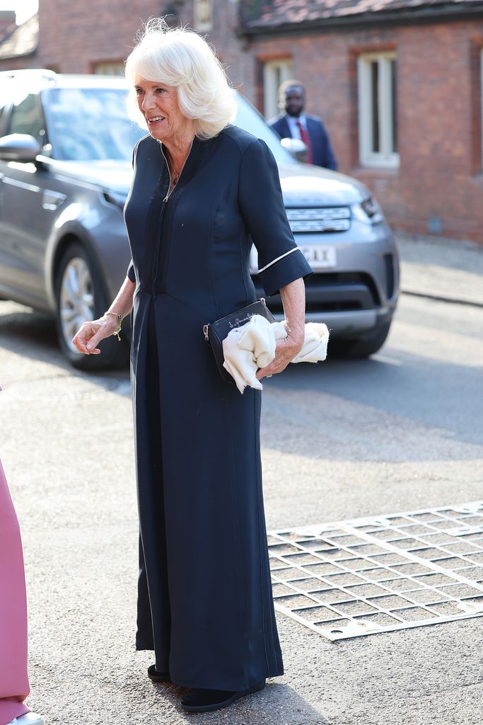 Queen Camilla in a dark blue dress