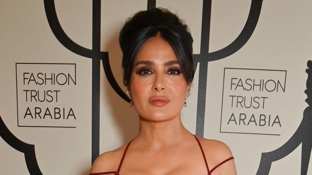 Salma Hayek’s curvaceous figure looks phenomenal in extremely tight red dress