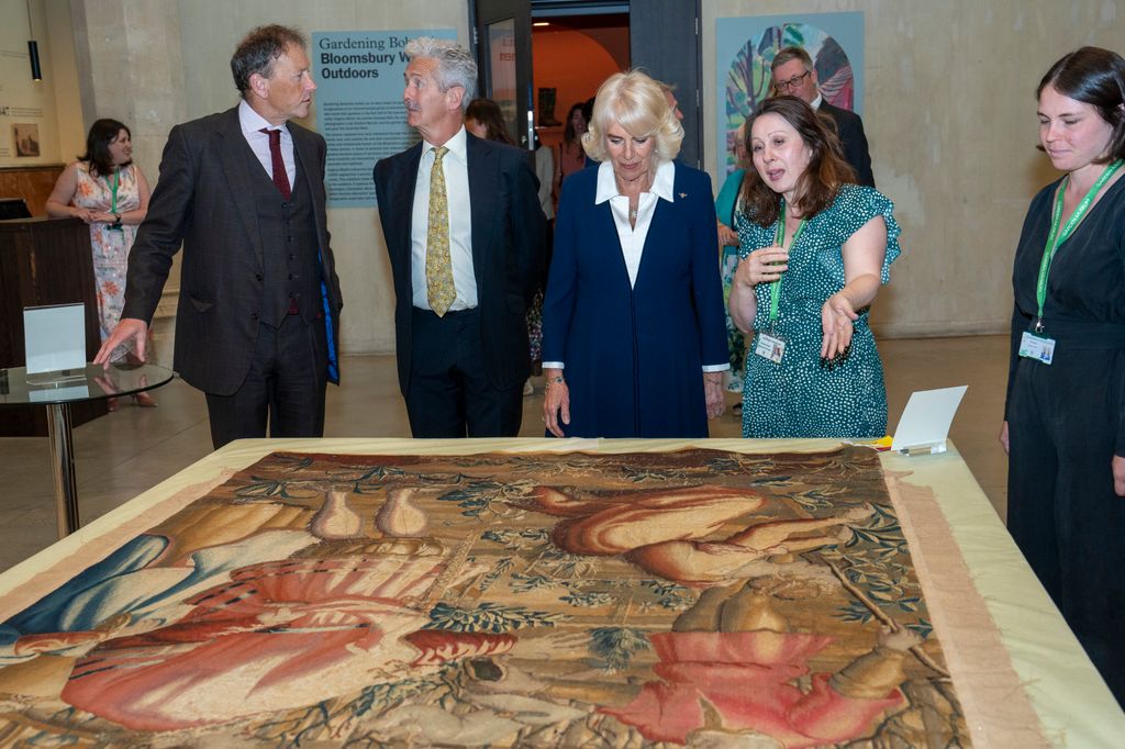 Camilla looks at a 17th-century tapestry during a visit to the Gardening Bohemia exhibition