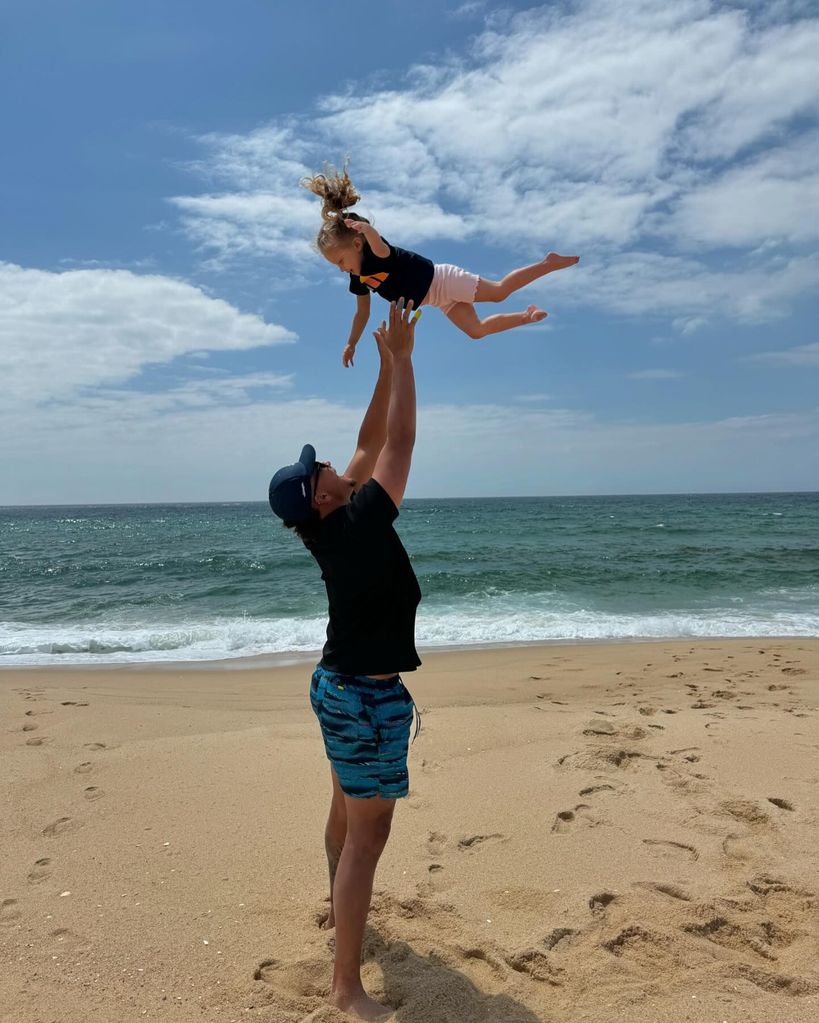 Patrick Mahomes tosses his daughter into the air