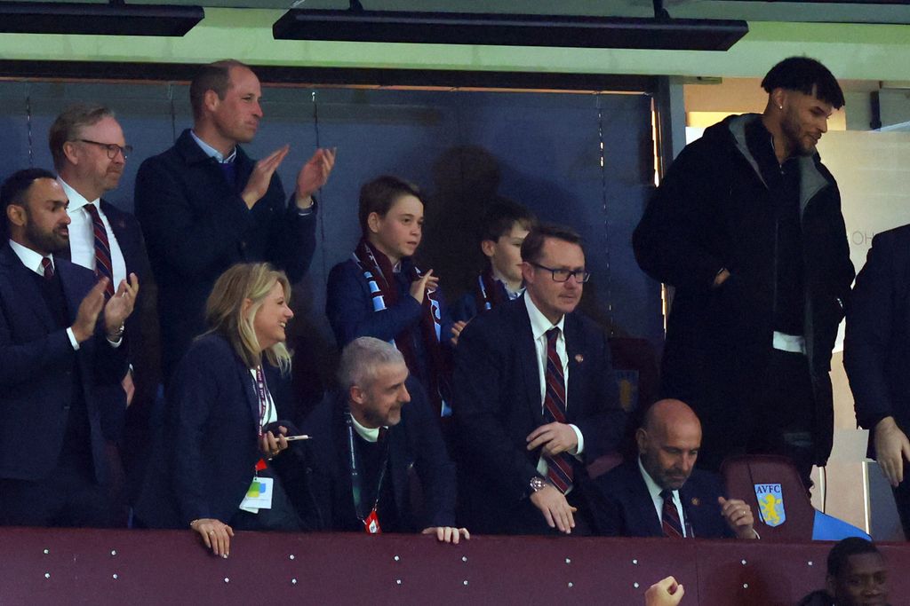 Prince William and Prince George are among the crowd cheering on the football team.
