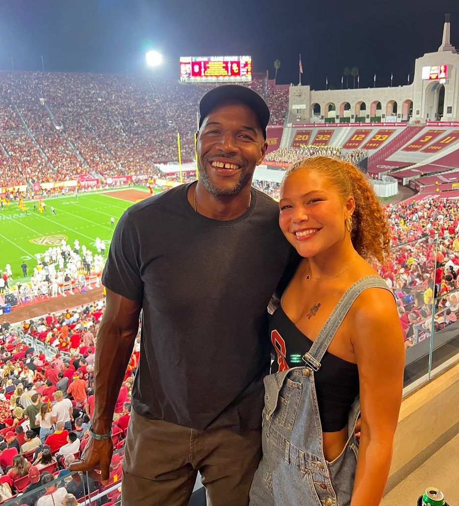 Michael Strahan with his daughter Isabella Strahan at a USC game