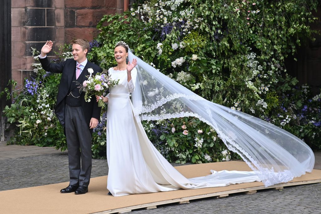 Hugh Grosvenor, Duke of Westminster and Olivia Henson wave to the crowds outside Chester Cathedral after their wedding