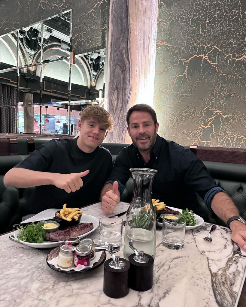 Jamie Redknapp and Beau give each other a thumbs up at dinner