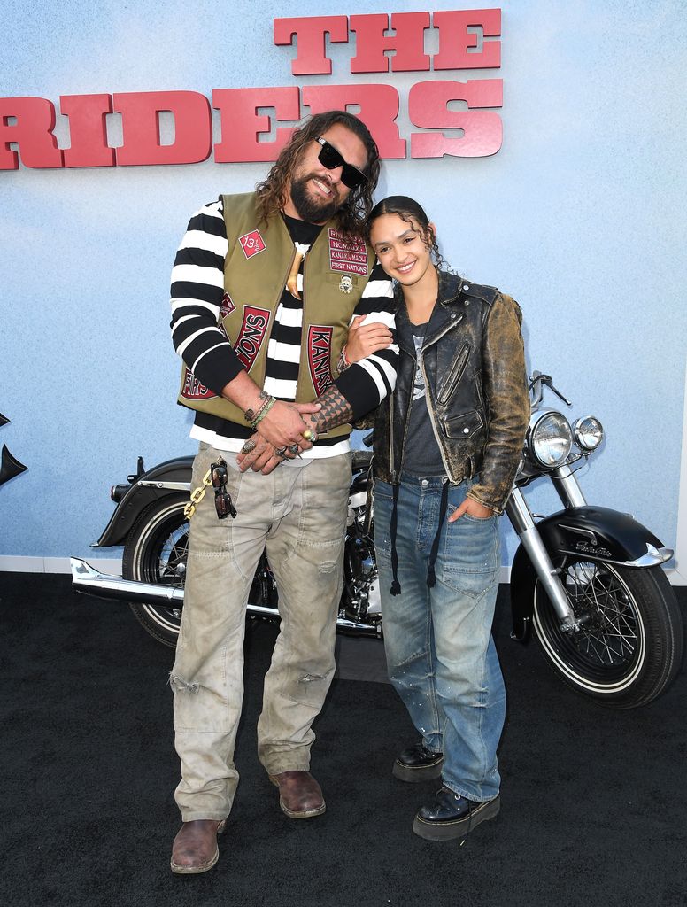     Jason Momoa and Lola Iolani Momoa hug each other on the red carpet