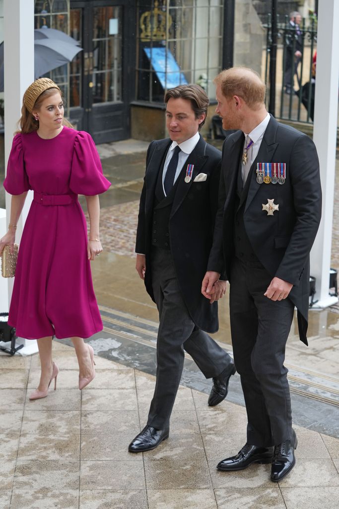 Beatrice and her husband Edoardo Mapelli Mozzi wearing a fuchsia Beula London dress at the coronation of King Charles III and Queen Camilla in 2023