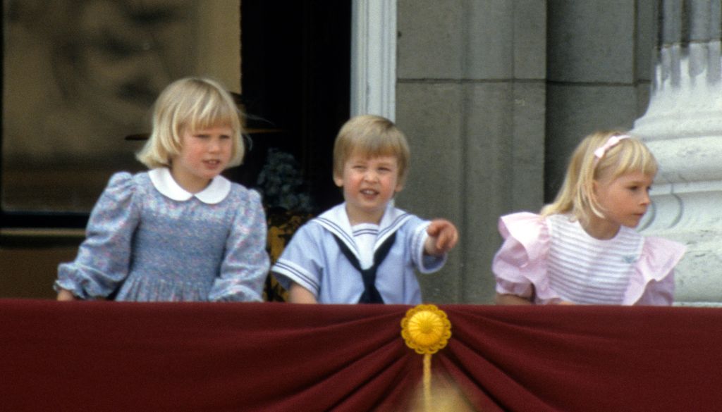 Zara Phillips, Prince William and Lady Davina Windsor stand on the balcony of Buckingham Palace during Trooping the Colour on June 15, 1985