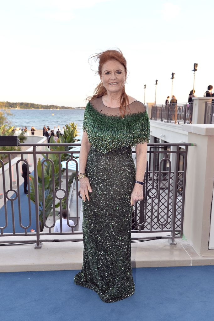 Sarah Ferguson on the rooftop in a shiny green dress