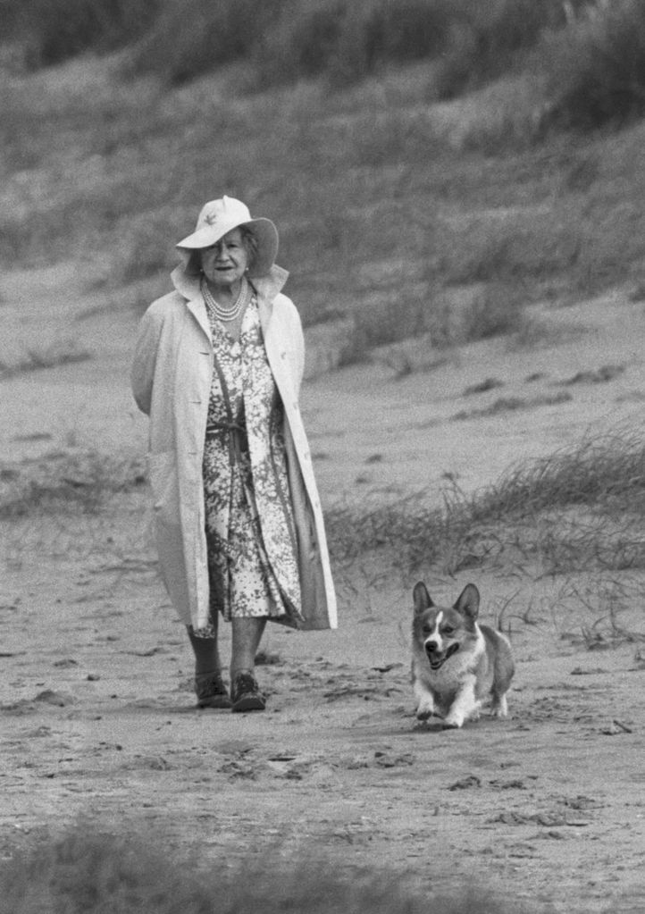 Elizabeth, The Queen Mother, strolling on the beach in 1987