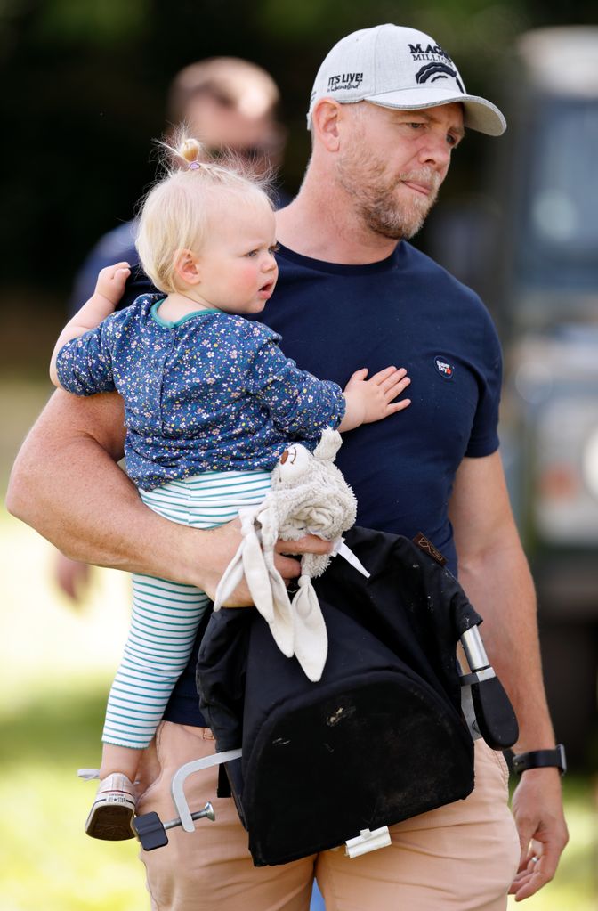 Mike Tindall holds his daughter, Lena Tindall.