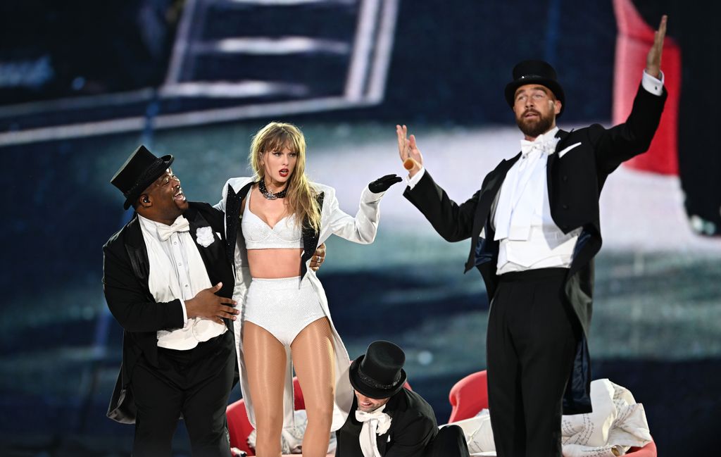 Taylor Swift is accompanied on stage by Travis Kelsey (right), "Taylor Swift |  The Eras Tour" On June 23, 2024 at Wembley Stadium in London, England