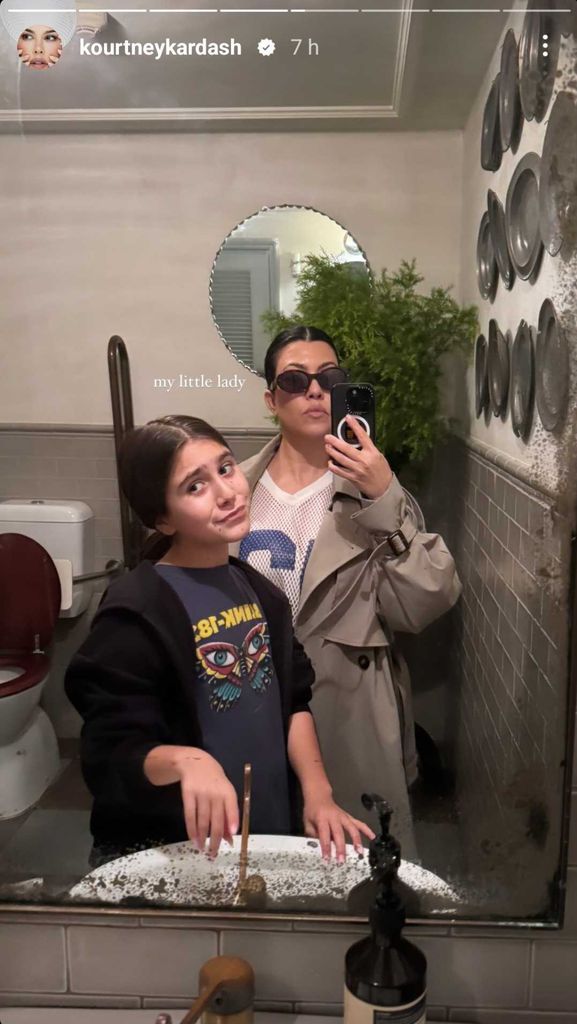 Kourtney Kardashian poses in the mirror with daughter Penelope