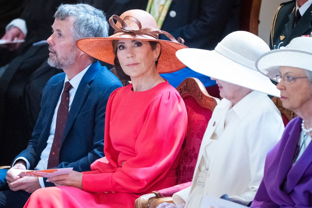 Queen Mary with hat next to King Frederick