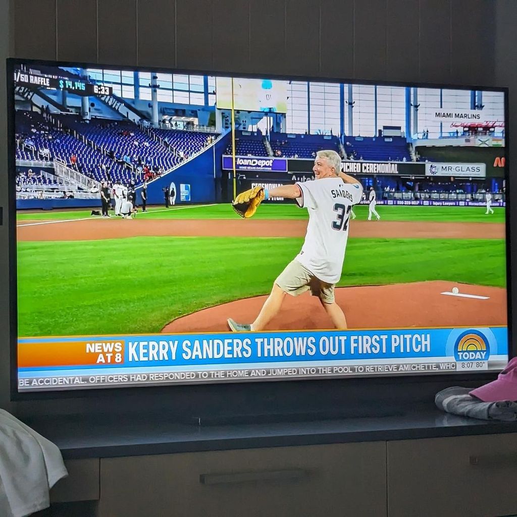 Kerry Sanders captures his segment on the Today Show after throwing out the first pitch at a Miami Marlins game