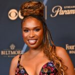 Jennifer Hudson highlights curvaceous figure in plunging tight dress