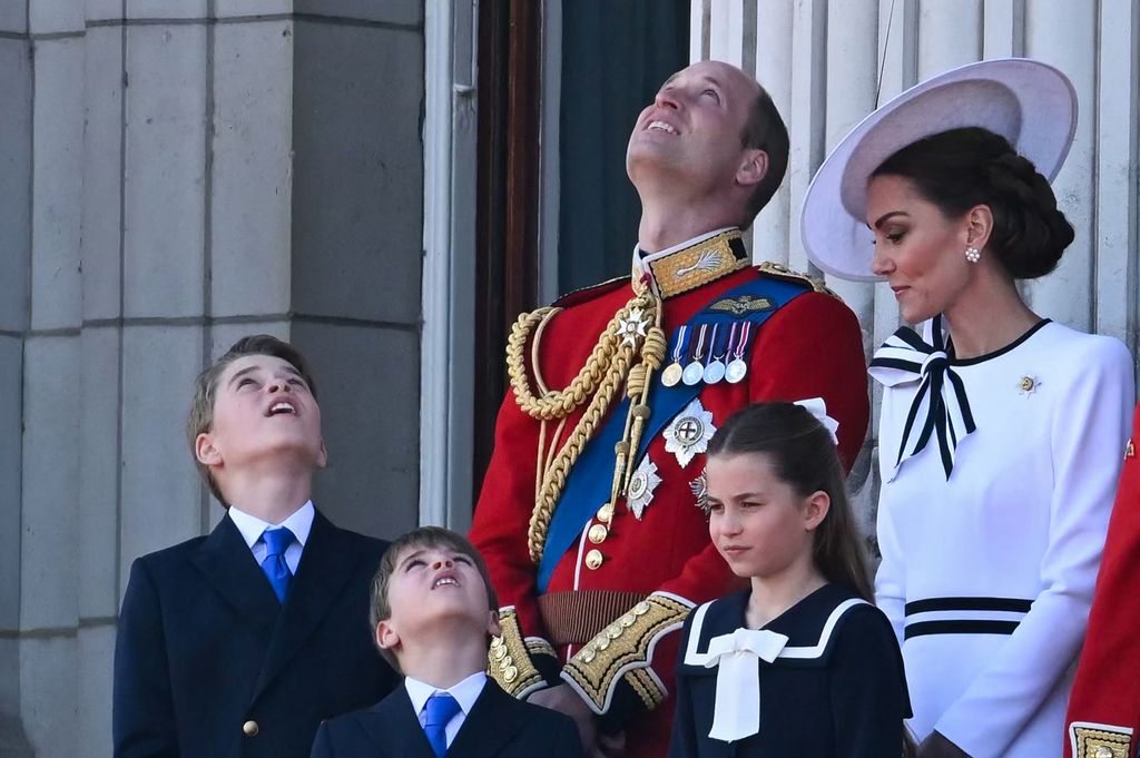 Princess Kate looks at Prince Louis on the balcony of Buckingham Palace after attending the King's Birthday Parade