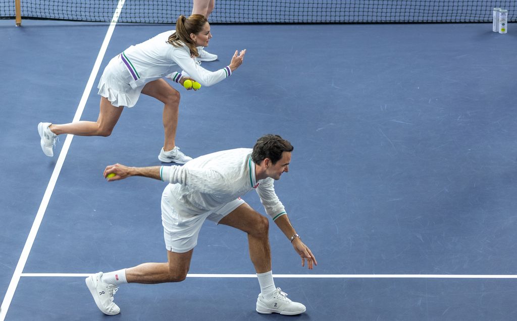 Princess Kate throwing Roger Federer a tennis ball