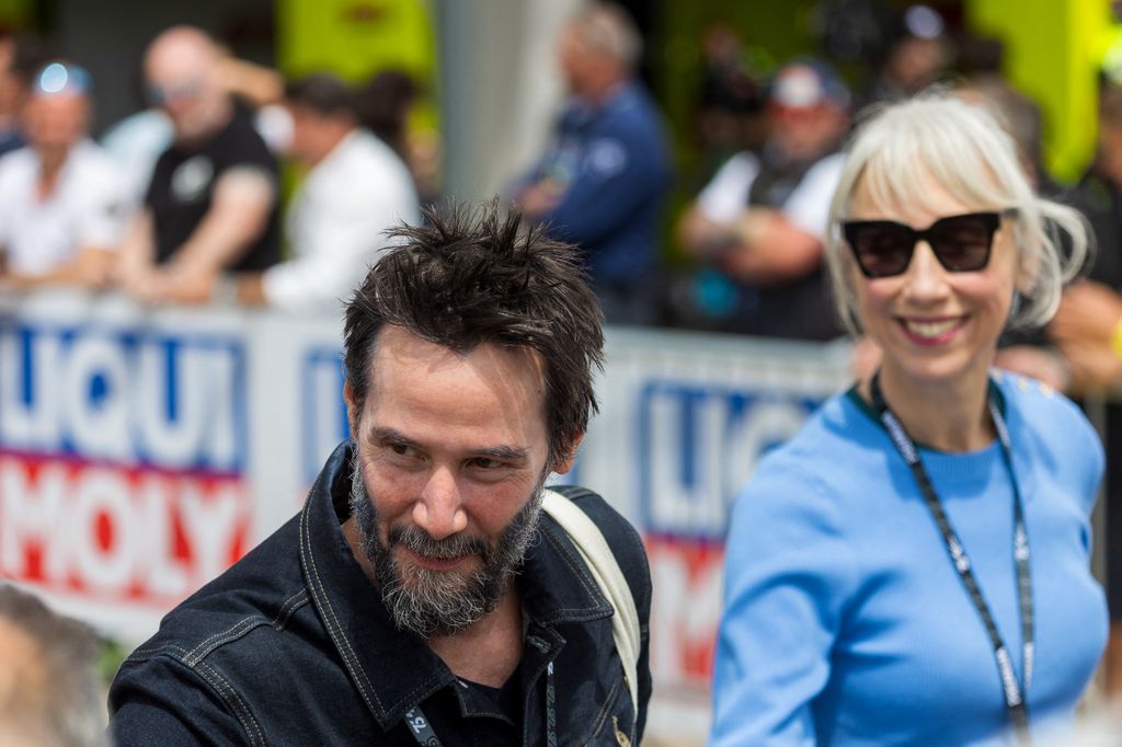 Keanu Reeves and his partner Alexandra Grant attending the German Motorcycle Grand Prix at the Sachsenring racetrack 