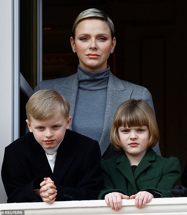 Jacques and Gabriella with their mother Princess Charlene in January 2023 watching the traditional Sainte Devote procession in Monaco
