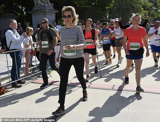 Queen Mathilde of Belgium pictured during the 43th edition of the 20 km door Brussel on Sunday