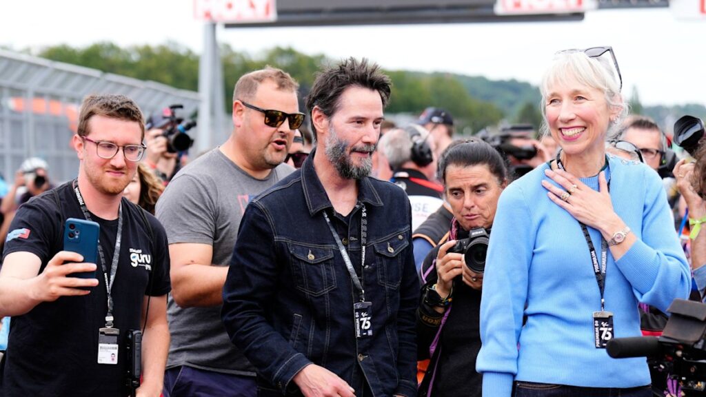 Keanu Reeves and rarely-seen girlfriend Alexandra Grant turn heads at racing event in Germany