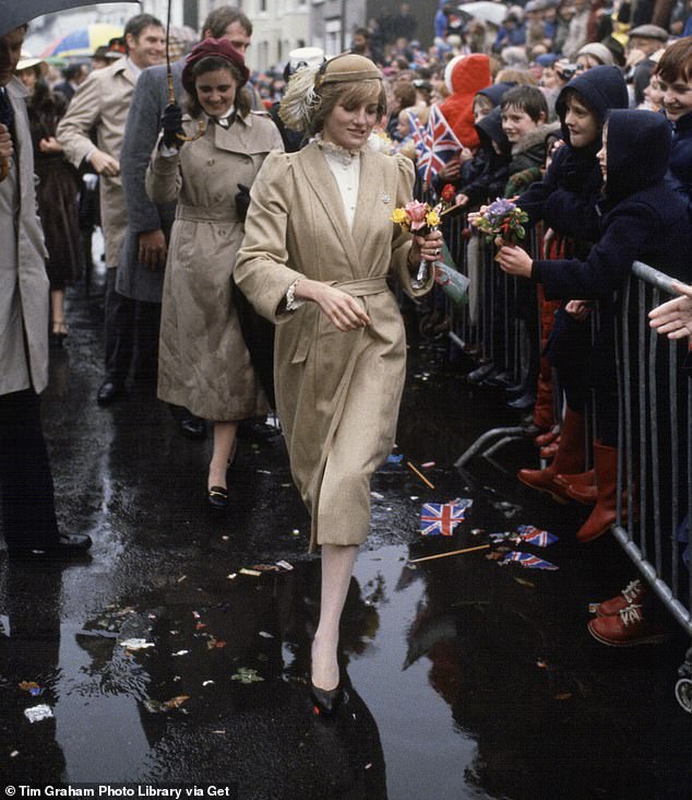 Dancing around the puddles and making a splash in beige coords on her first official visit to Wales in 1981
