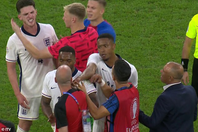 England's teammates had to pull Rice back to calm the situation.