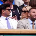 Katherine Jenkins looks in high spirits at Wimbledon as she joins David Beckham and husband Andrew Levitas in the Royal Box following OBE row