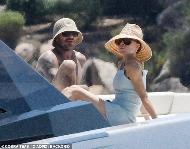 Victoria Beckham suns herself on a yacht with shirtless David as they enjoy trip to Sardinia ahead of their silver wedding anniversary