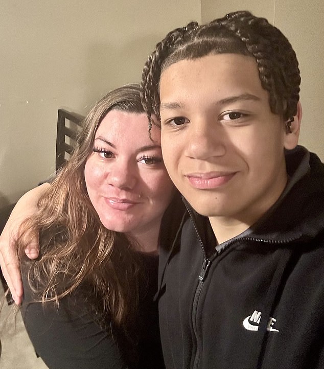 Ms Hampton, pictured with her 15-year-old son Tyreek Jones, was initially told the coil had suddenly fallen off.